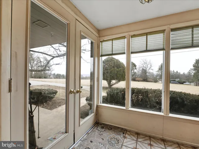 a view of a glass door and a porch