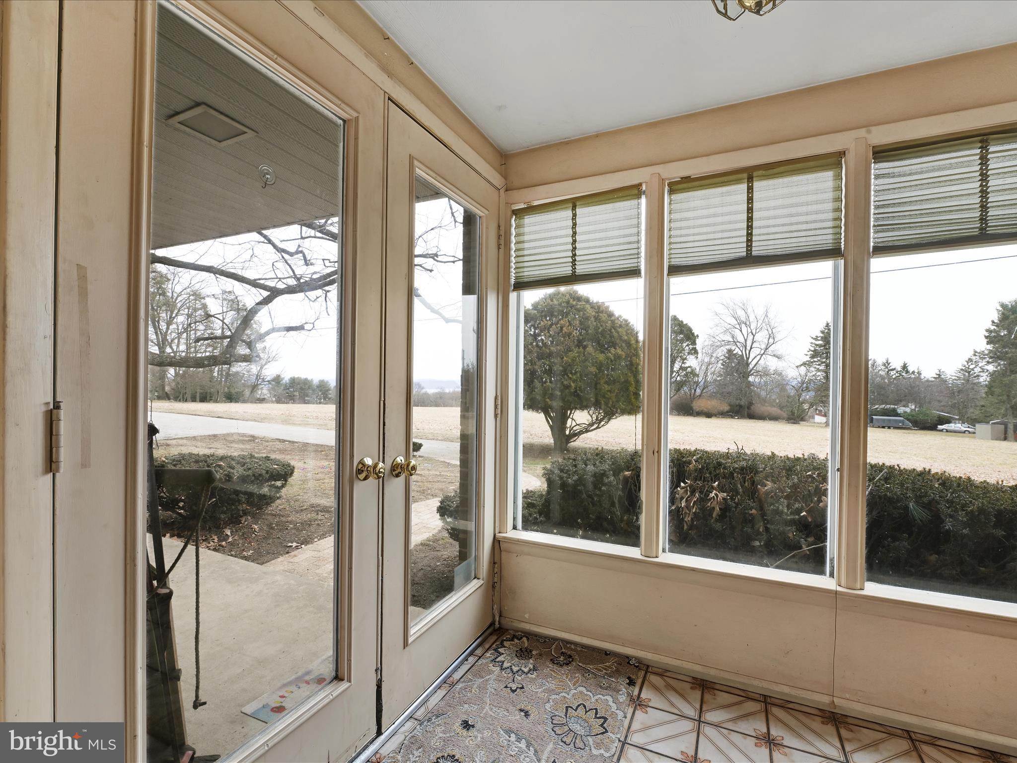 1181 Knights View Road Wrightsville, PA 17368 - Photo 17 of 40 a view of a glass door and a porch