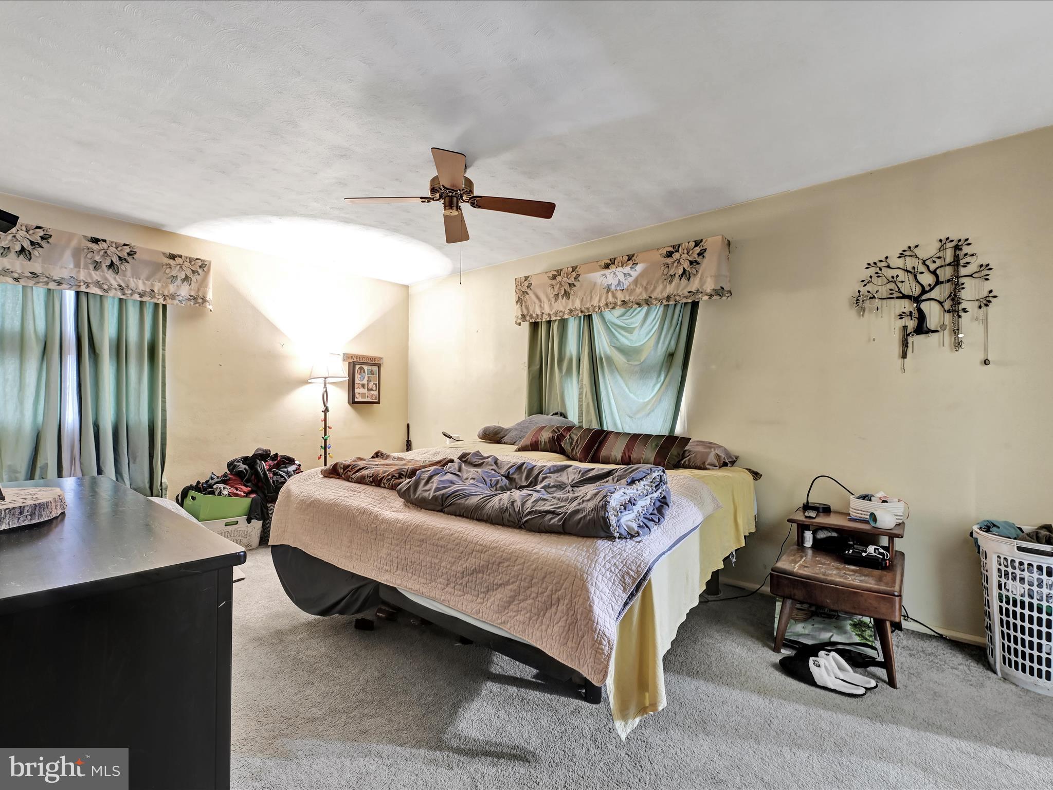 1181 Knights View Road Wrightsville, PA 17368 - Photo 22 of 40 a bedroom with a bed bed and a chair