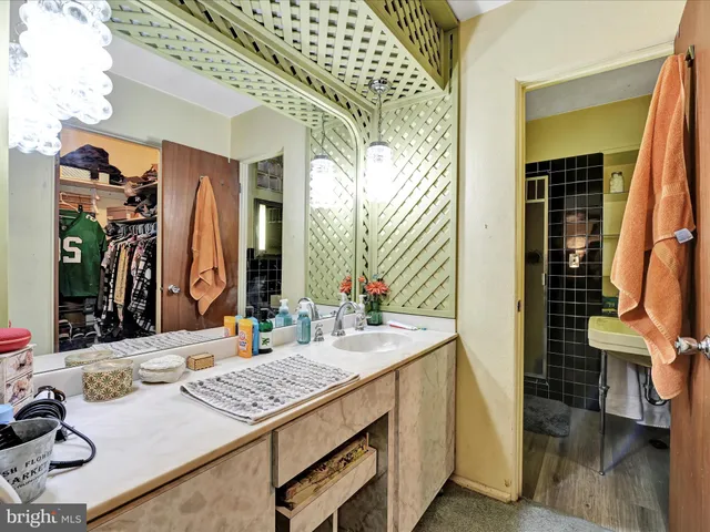 a bedroom with a bed and a tv