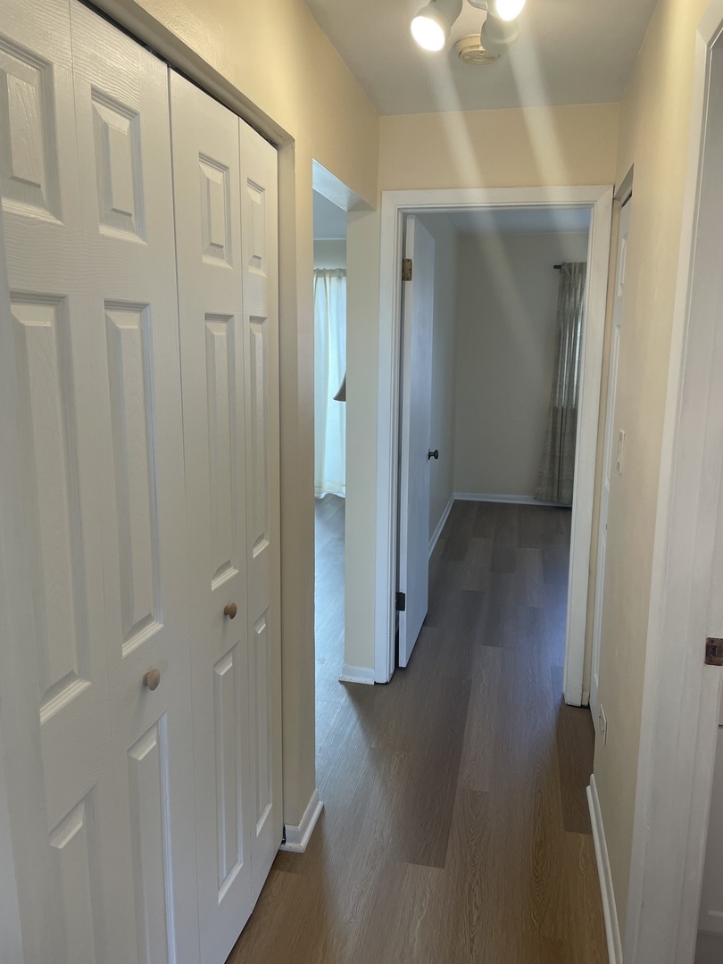 4150 Central Road, Unit 3E Glenview, IL 60025 - Photo 2 of 8 a view of a hallway with wooden floor