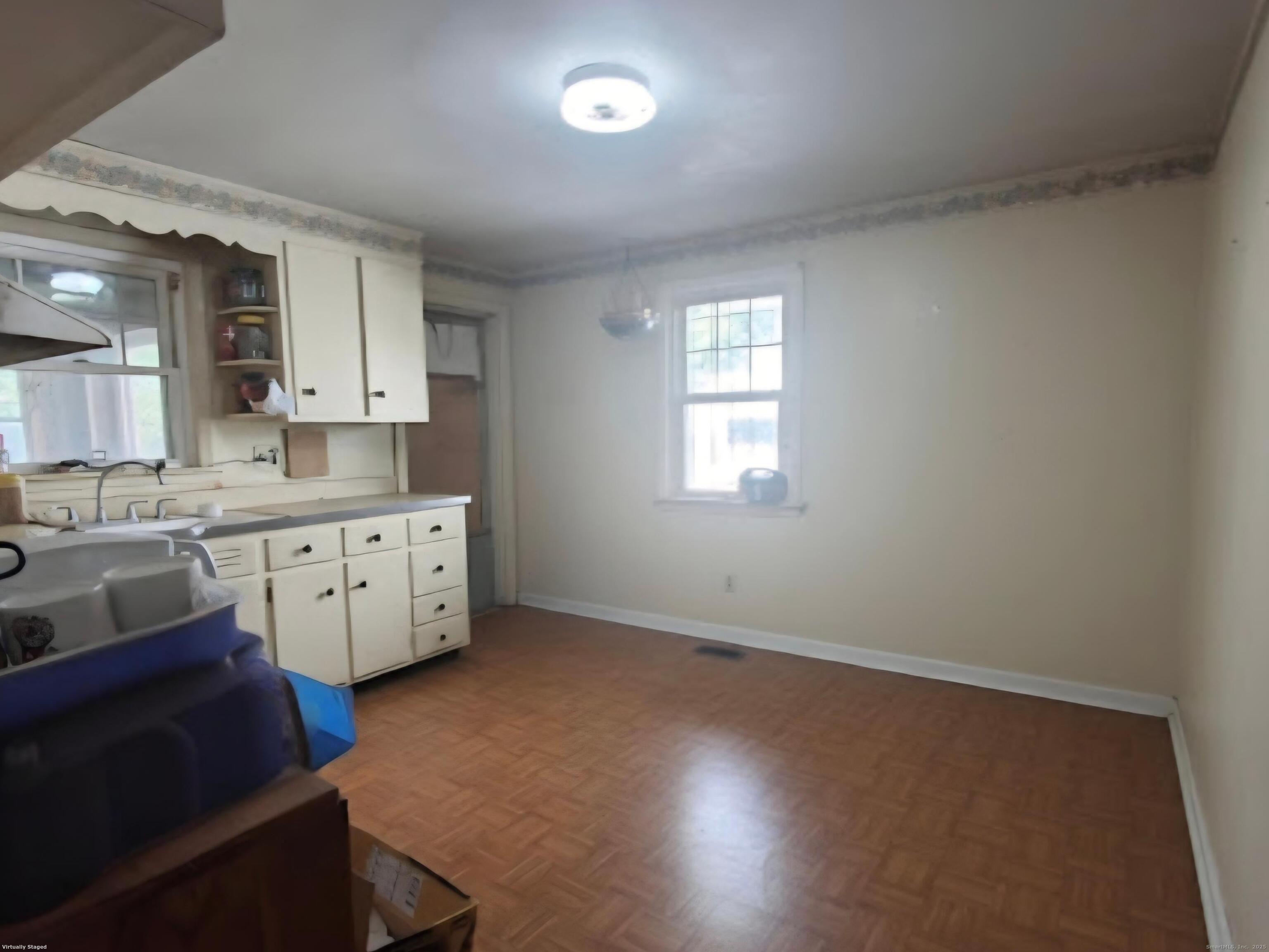 114 Oxford Street Bridgeport, CT 06606 - Photo 3 of 8 a kitchen with granite countertop a sink cabinets stainless steel appliances and a window
