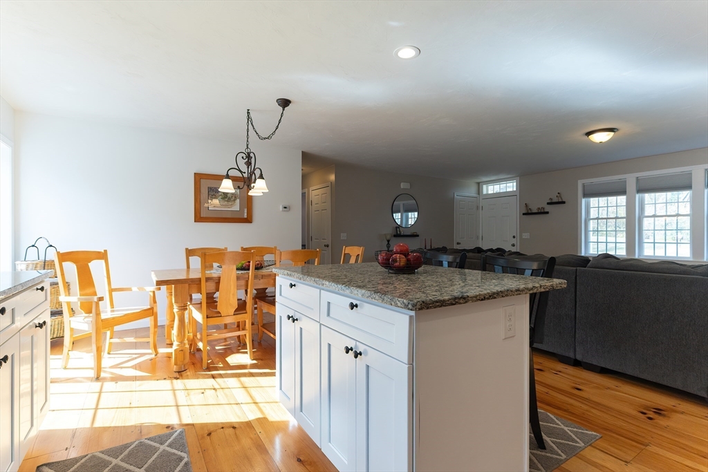 11 Shea Road West Brookfield, MA 01585 - Photo 19 of 42 a kitchen with granite countertop a stove a sink a dining table and chairs