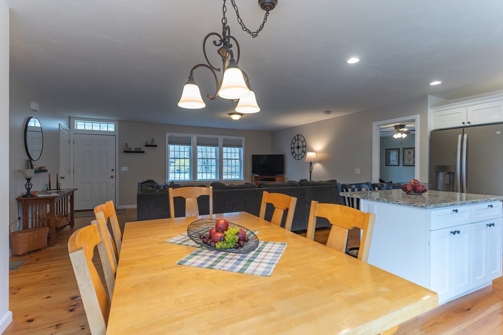 11 Shea Road West Brookfield, MA 01585 - Photo 22 of 42 a view of a dining room and livingroom with furniture wooden floor a chandelier