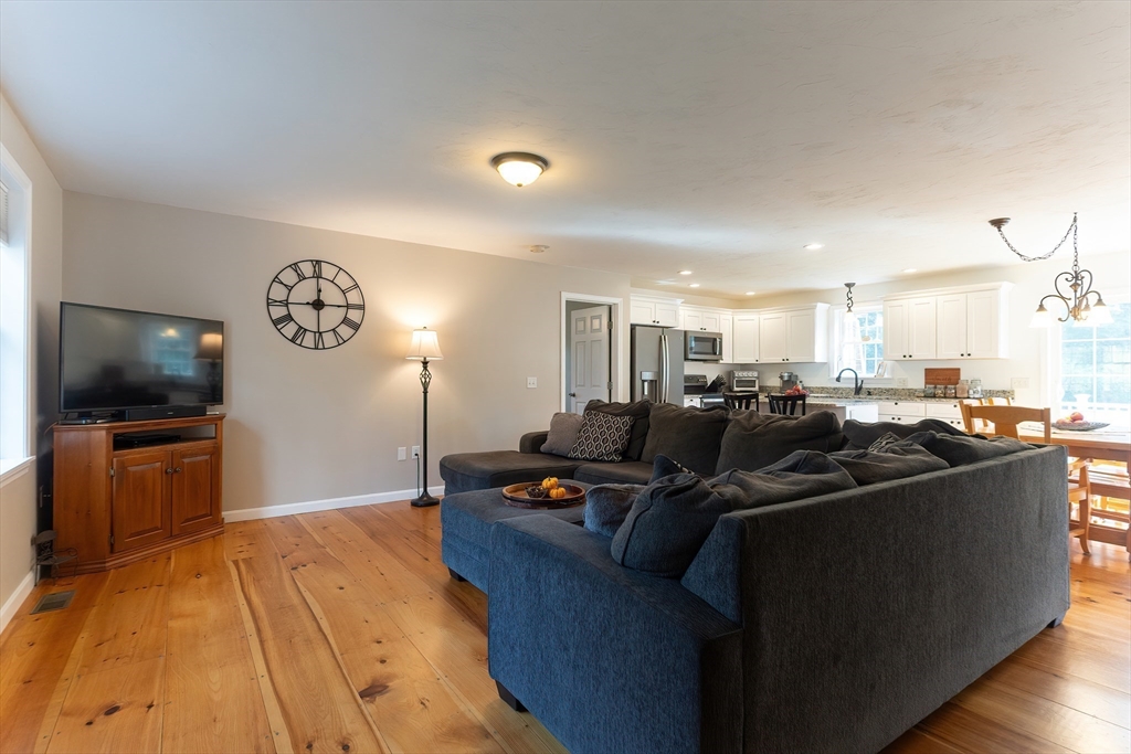 11 Shea Road West Brookfield, MA 01585 - Photo 25 of 42 a living room with furniture and a flat screen tv