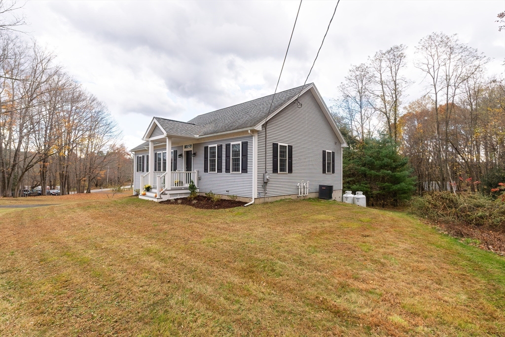 11 Shea Road West Brookfield, MA 01585 - Photo 3 of 42 a view of a house with a yard and garage