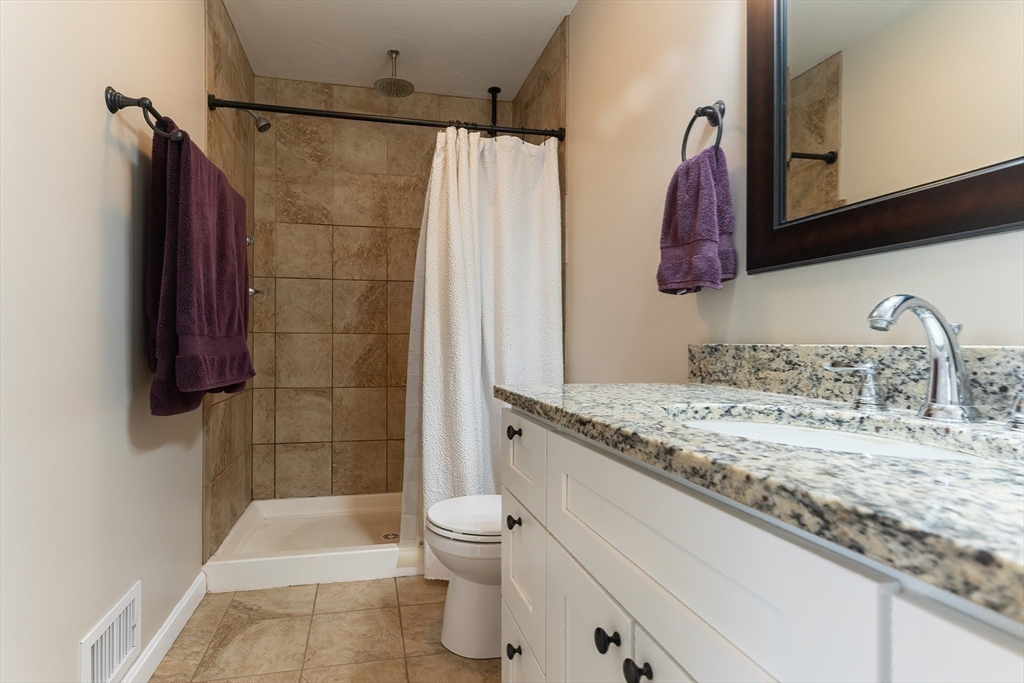 11 Shea Road West Brookfield, MA 01585 - Photo 31 of 42 a bathroom with a granite countertop sink a toilet and shower
