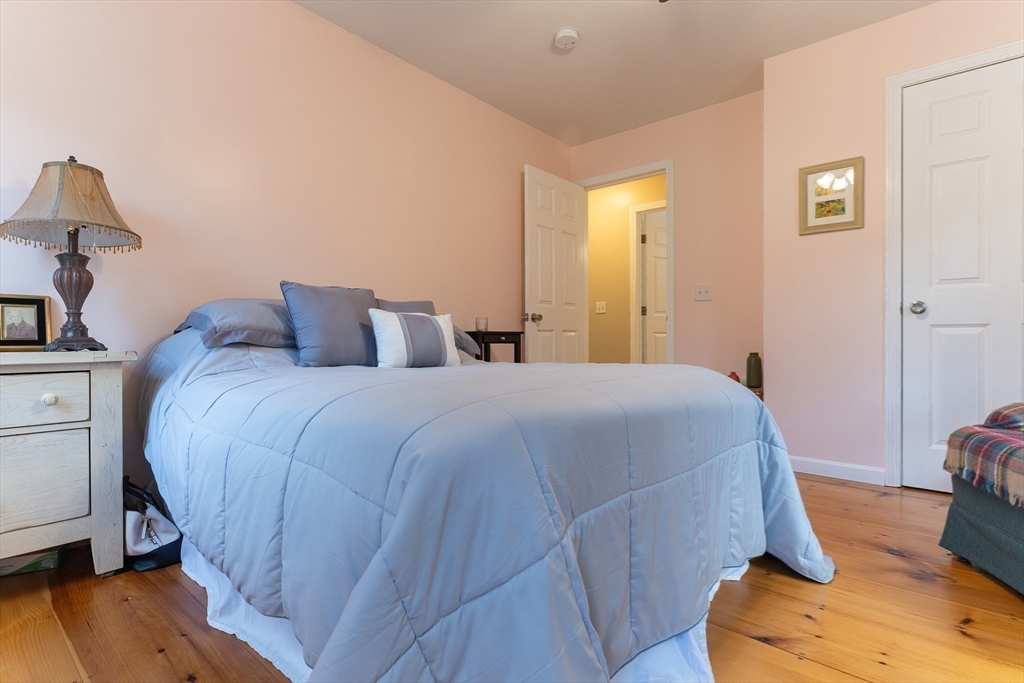 11 Shea Road West Brookfield, MA 01585 - Photo 32 of 42 a bedroom with a bed and wooden floor