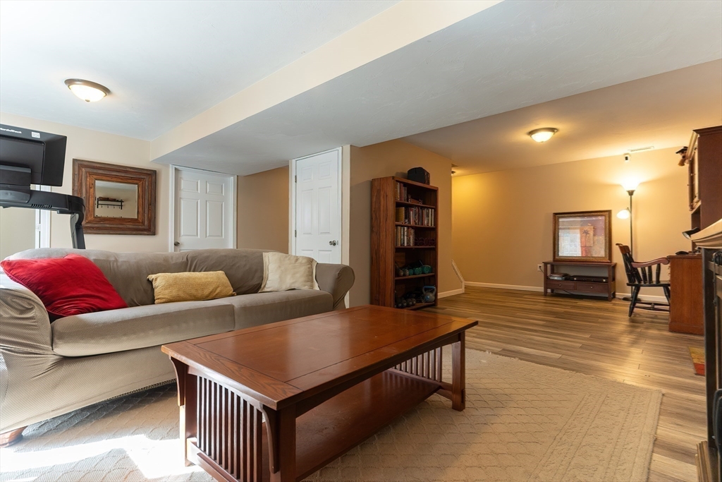 11 Shea Road West Brookfield, MA 01585 - Photo 36 of 42 a living room with furniture and a wooden floor