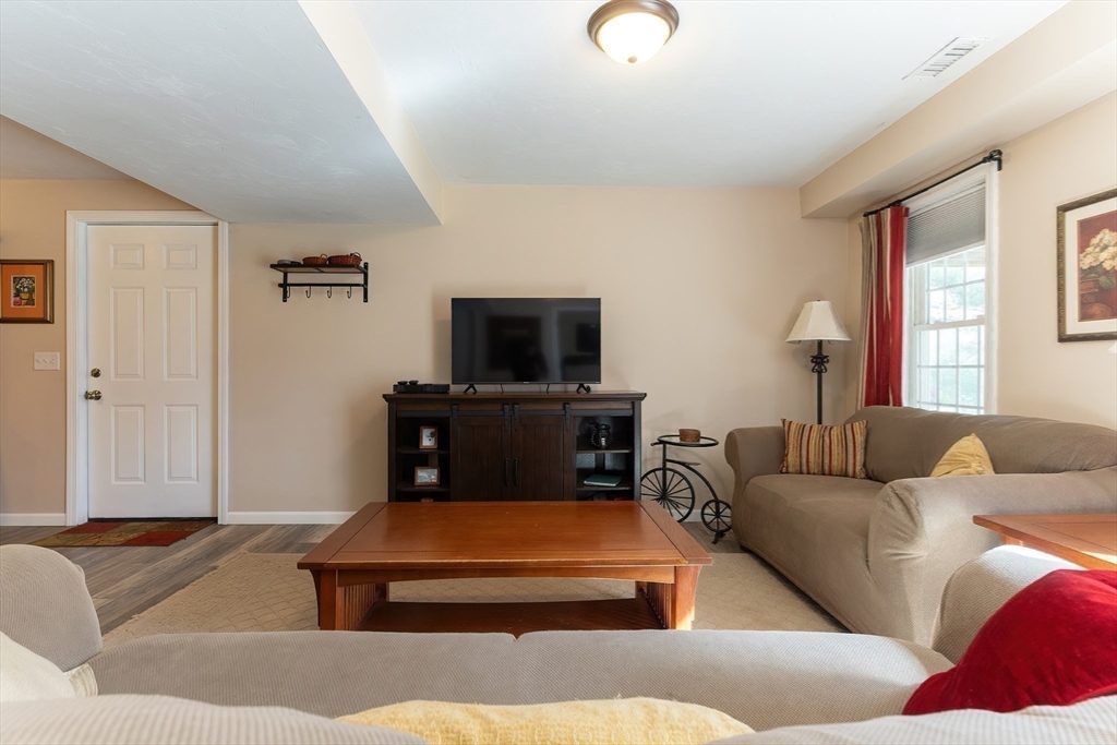 11 Shea Road West Brookfield, MA 01585 - Photo 37 of 42 a living room with furniture and a flat screen tv