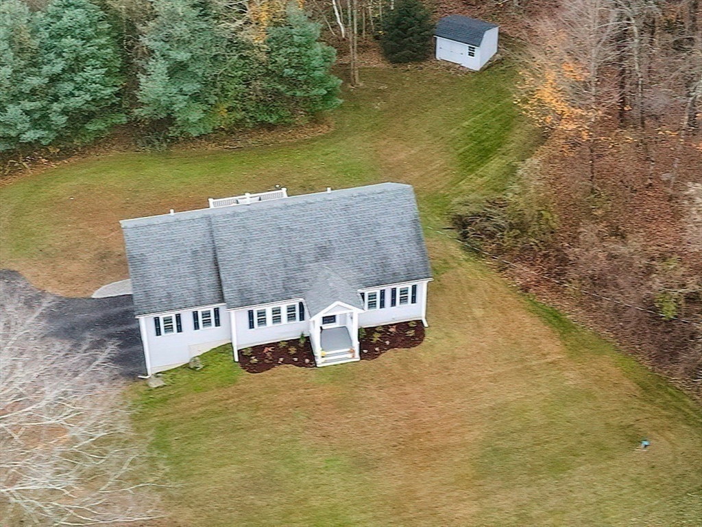 11 Shea Road West Brookfield, MA 01585 - Photo 9 of 42 a view of a lake with a house in the background