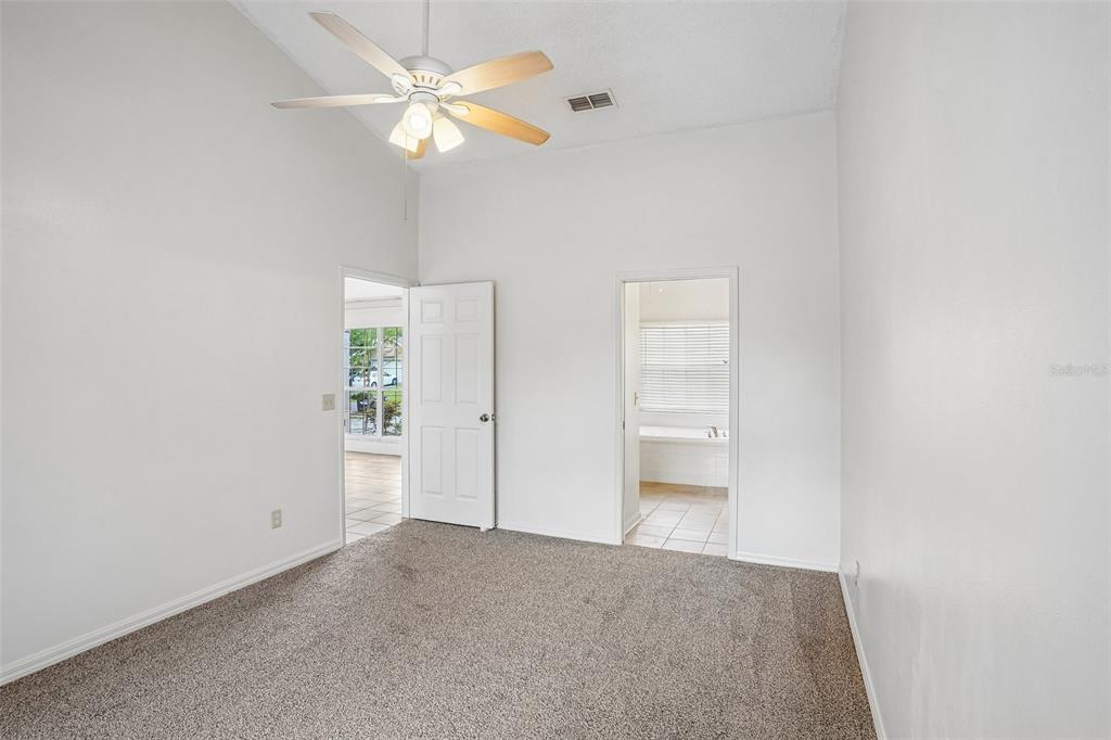 2596 Alclobe Circle Ocoee, FL 34761 - Photo 34 of 70 an empty room with closet and a ceiling fan