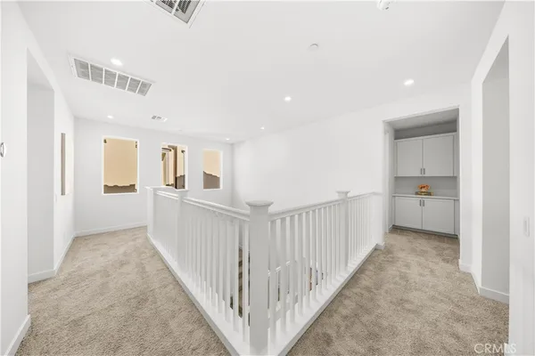 a view of a hallway with closet and entryway