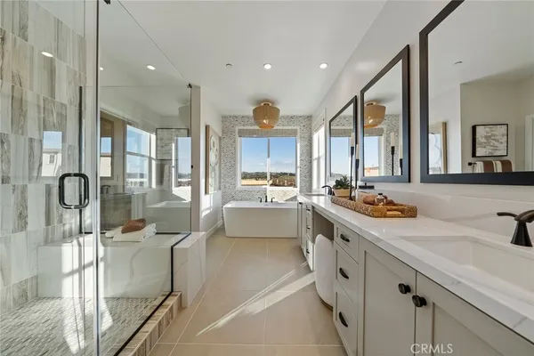a large kitchen with kitchen island a large counter top space a sink and stainless steel appliances