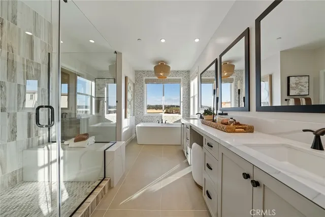 a large kitchen with kitchen island a large counter top space a sink and stainless steel appliances