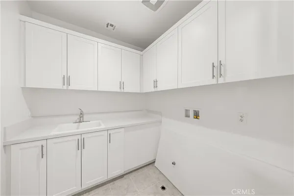 a kitchen with white cabinets