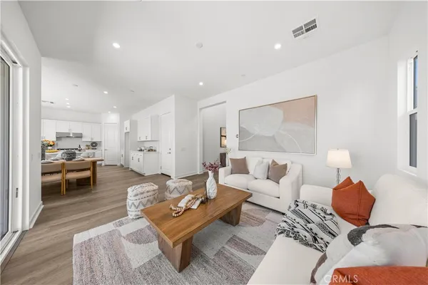 a living room with furniture and a table