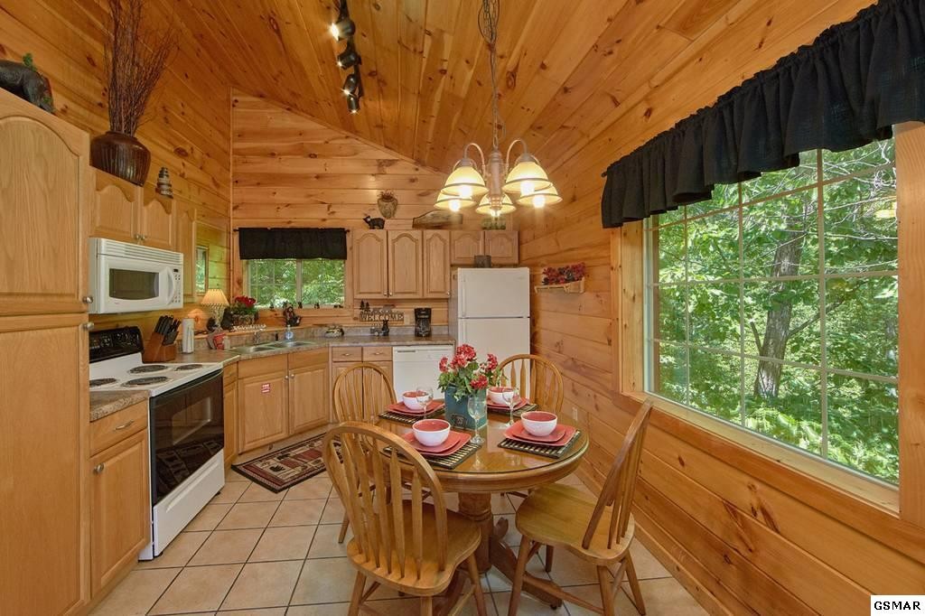 2116 Memory Way Sevierville, TN 37876 - Photo 9 of 16 a view of a dining table and chairs in the patio
