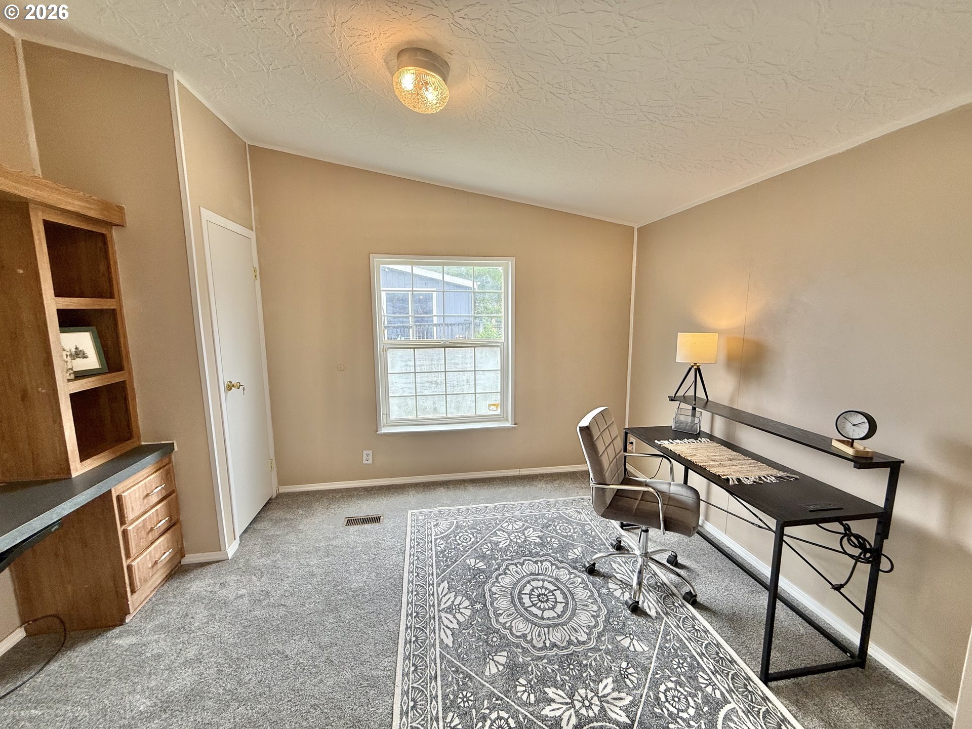 1282 3rd Street, Unit 37 Lafayette, OR 97127 - Photo 17 of 28 a living room with furniture and a window