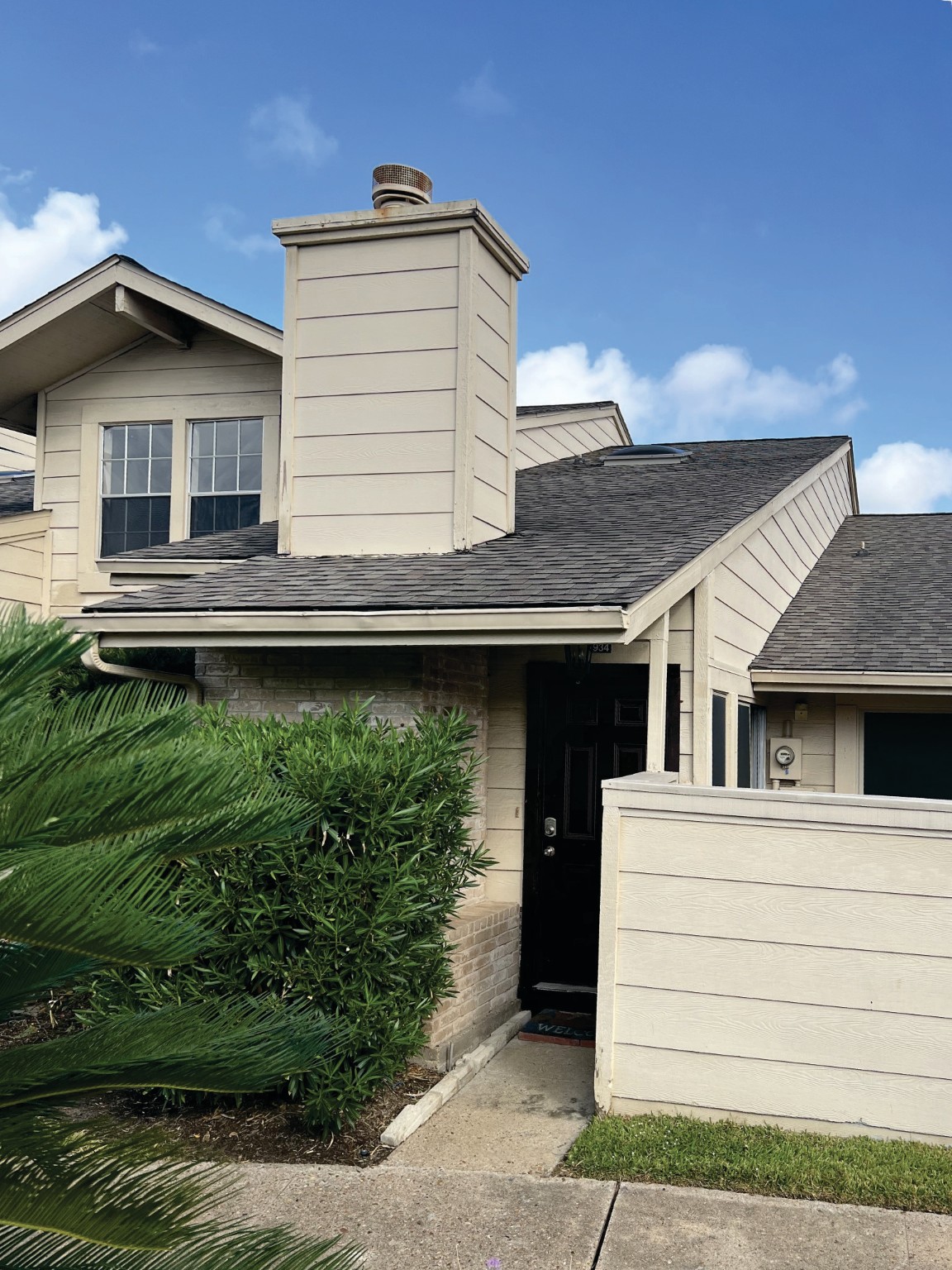 a house view with a backyard space