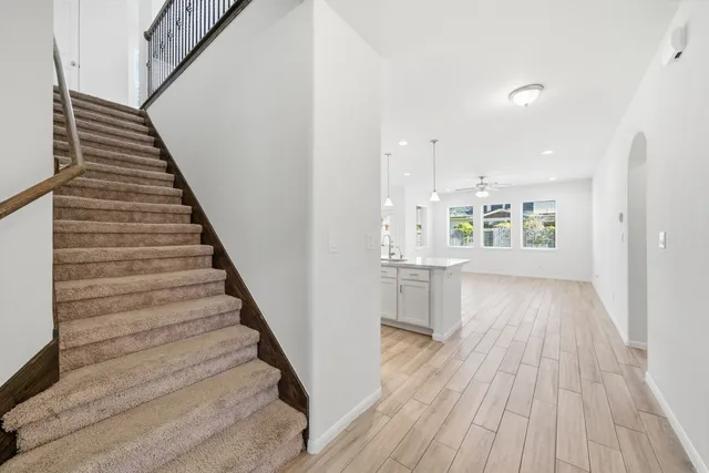 a view of an entryway with wooden floor