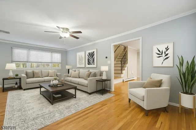 an empty room with a window and ceiling fan