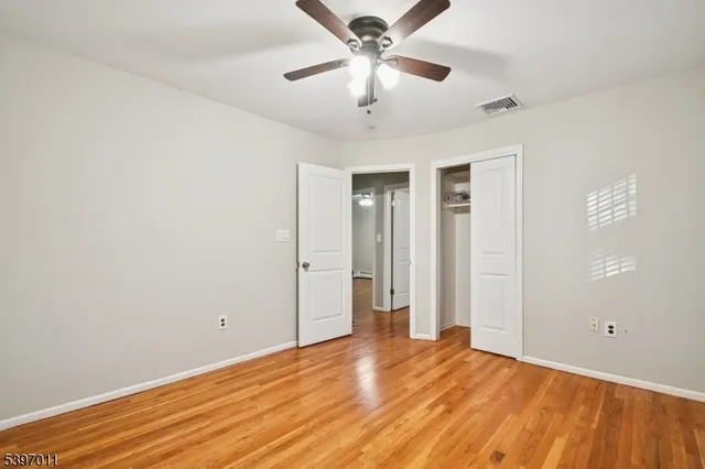 a bed room with a bed and a window