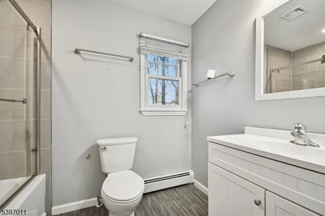 a view of a bathroom with a sink and a mirror