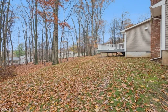 a view of a patio with wooden floor and fence