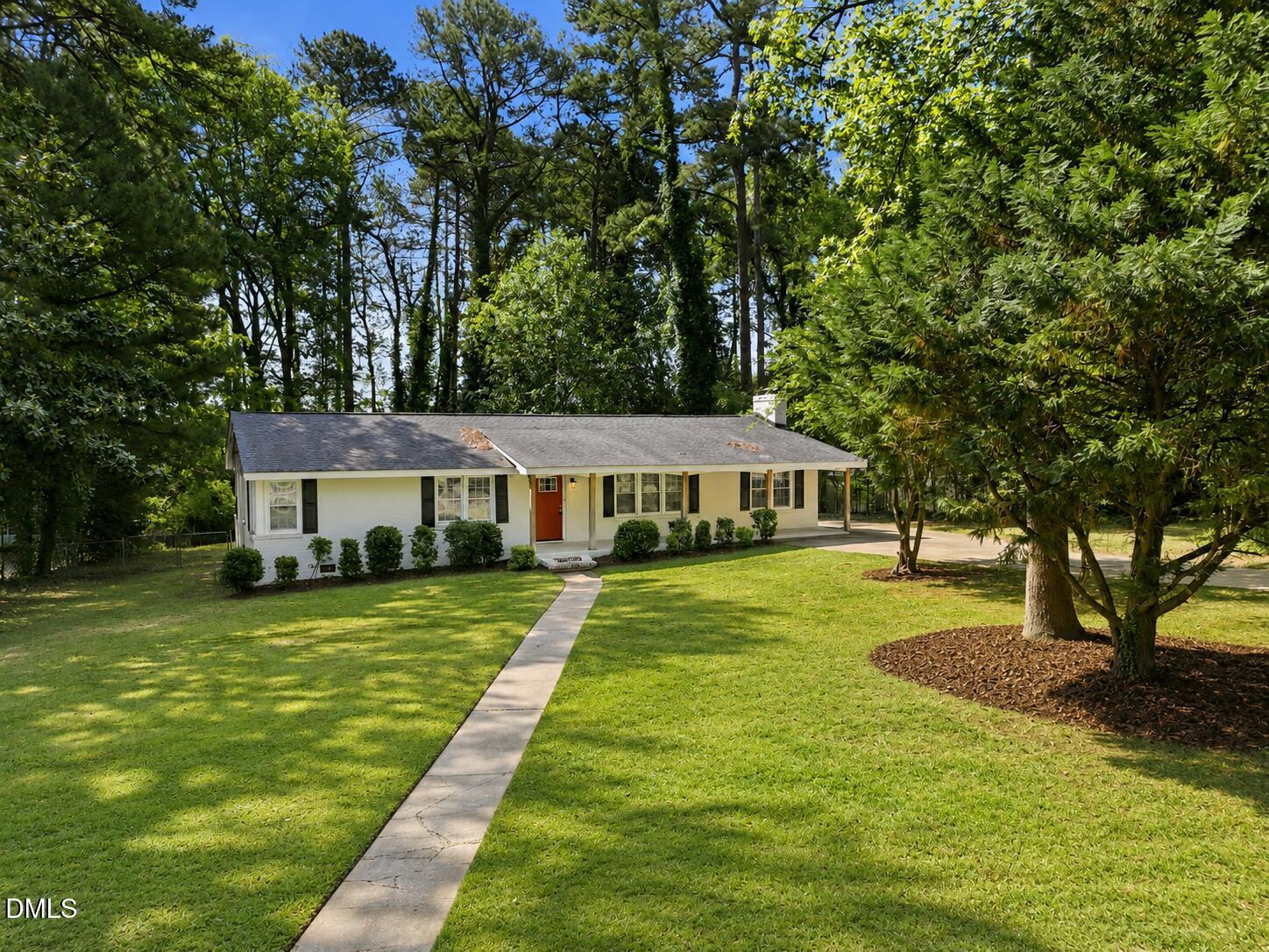 2950 Glenridge Drive Raleigh, NC 27604 - Photo 3 of 53 a front view of a house with a yard