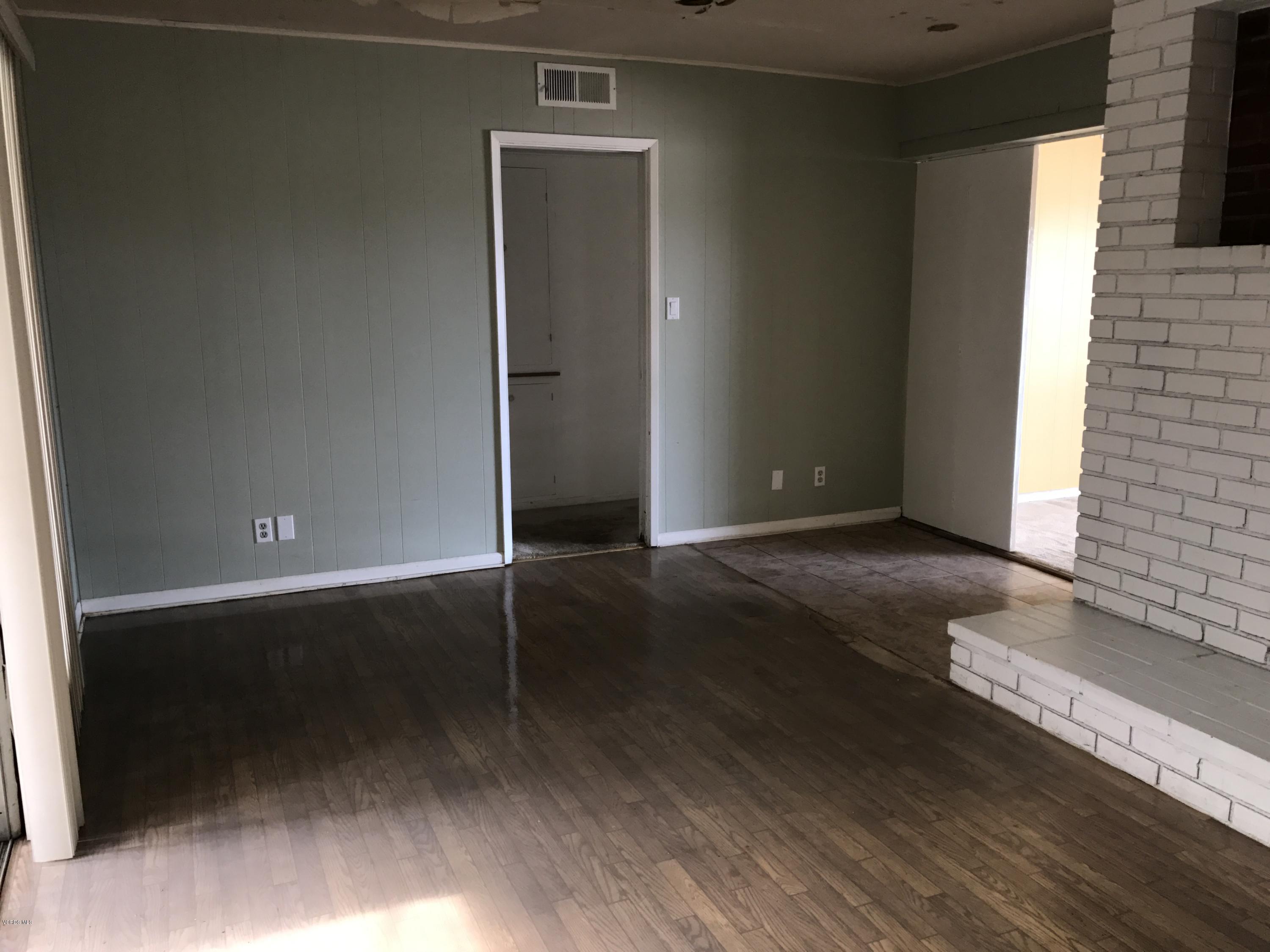 1660 Teal Club Road Oxnard, CA 93030 - Photo 9 of 18 an empty room with wooden floor