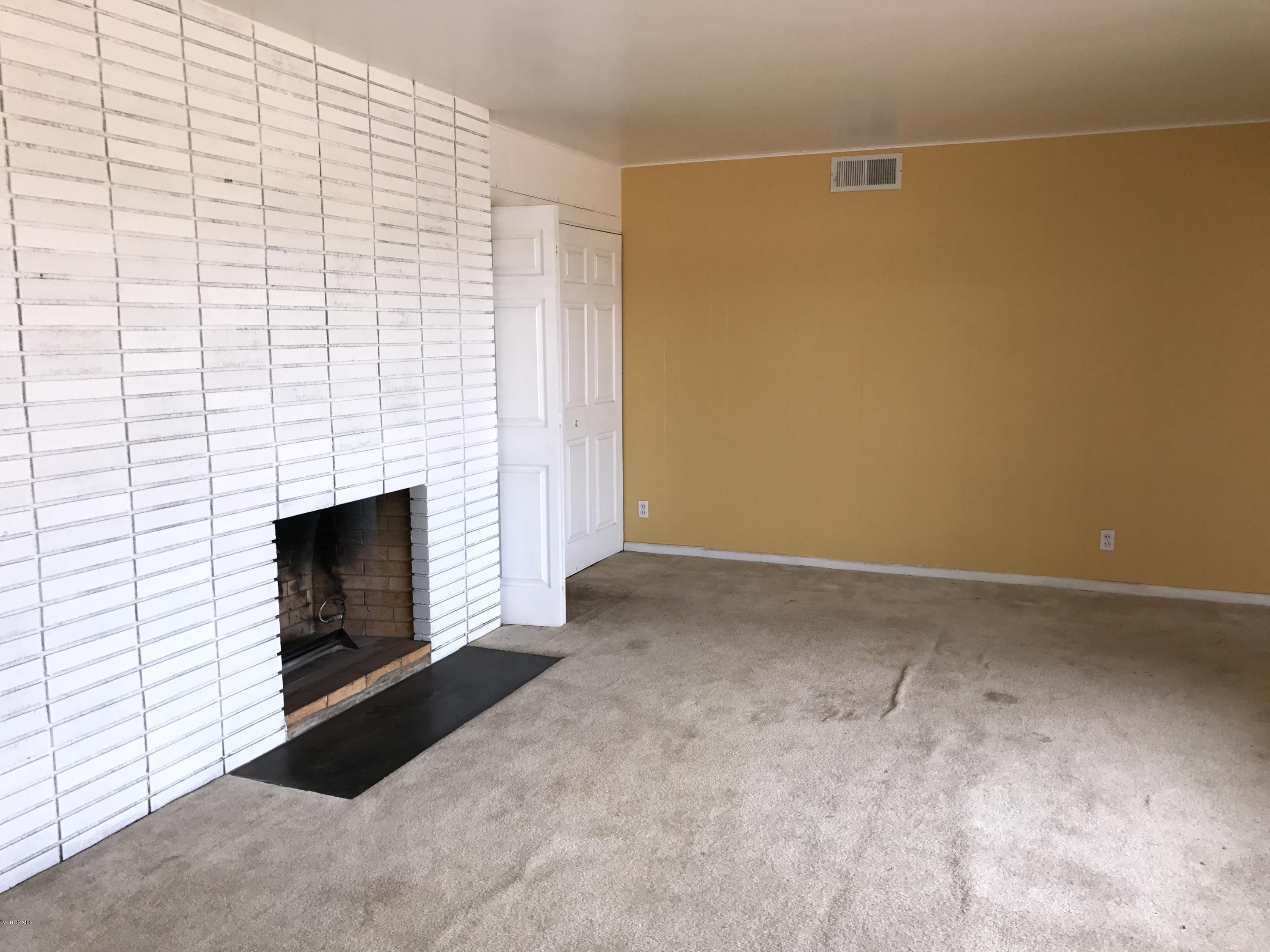 1660 Teal Club Road Oxnard, CA 93030 - Photo 10 of 18 a view of empty room with a fireplace