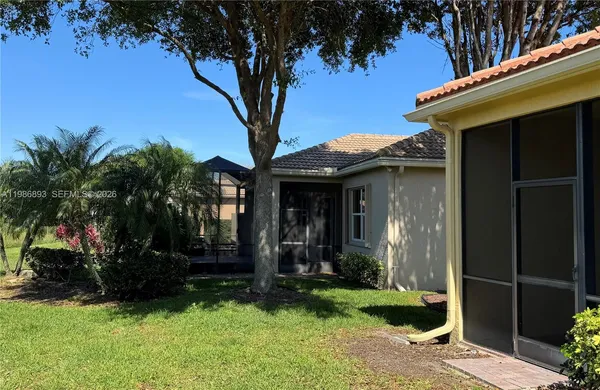 a aerial view of a house with swimming pool and lake view