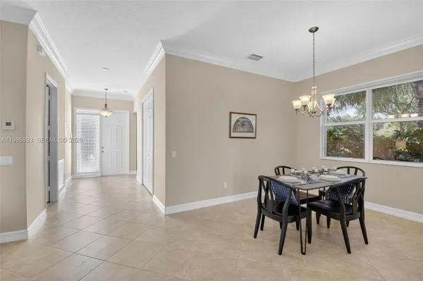 a kitchen with stainless steel appliances granite countertop a refrigerator a stove a sink and a microwave