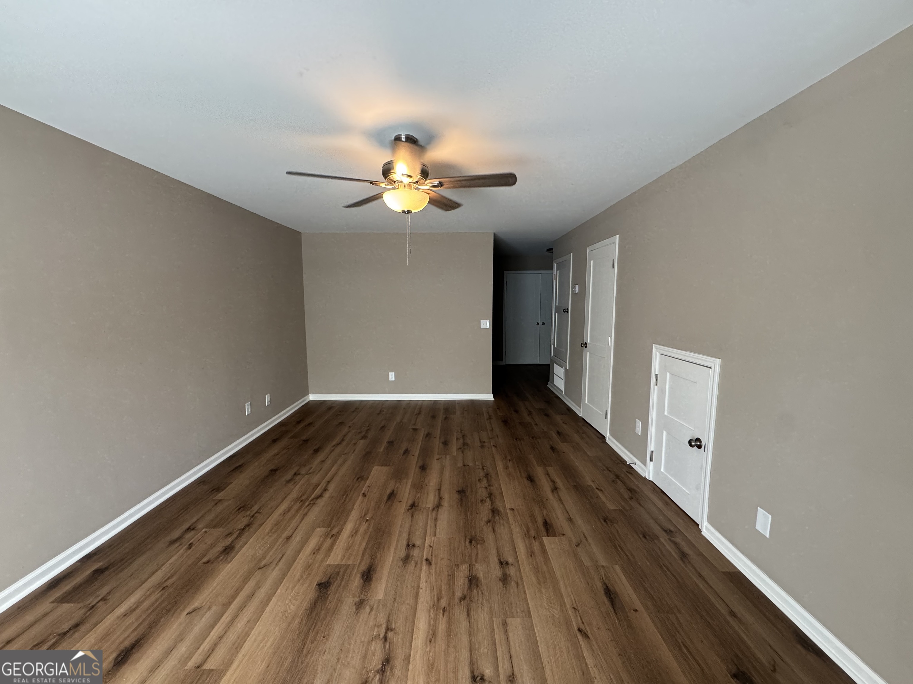 4235 Debby Street Columbus, GA 31907 - Photo 3 of 9 wooden floor in an empty room with a window