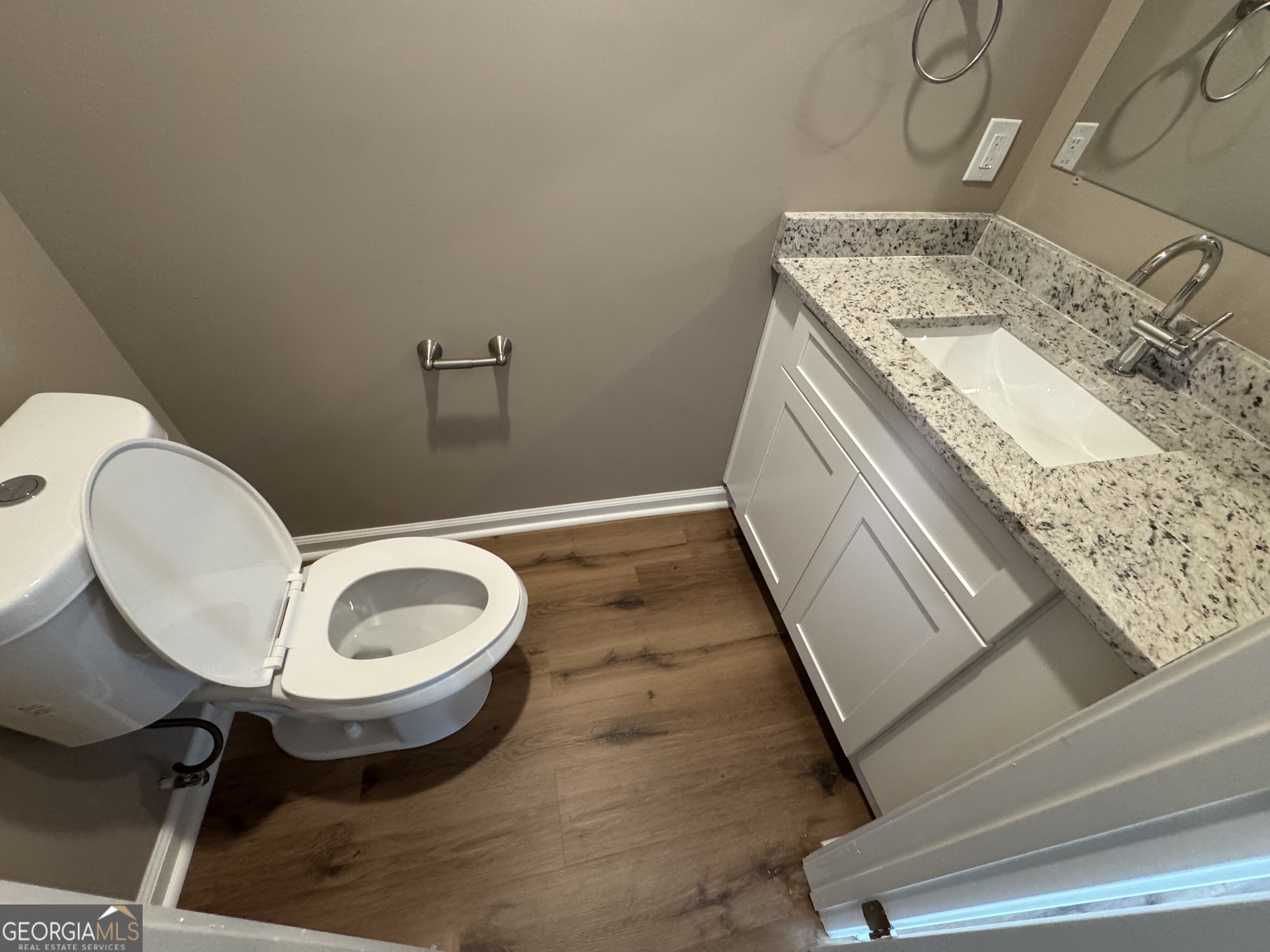 4235 Debby Street Columbus, GA 31907 - Photo 6 of 9 a bathroom with a granite countertop sink and a mirror