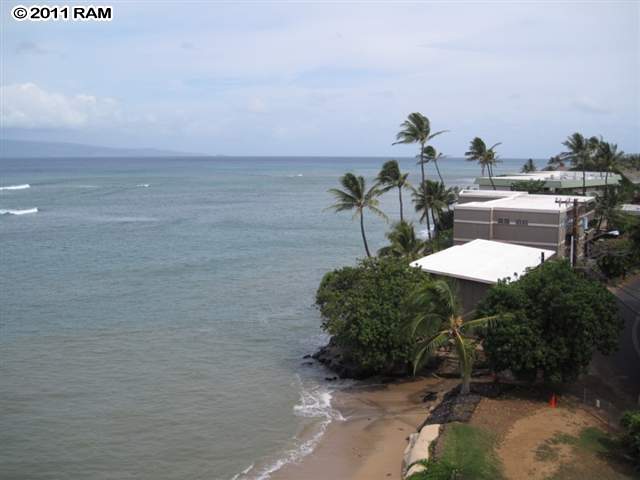 4401 Lower Honoapiilani Road, Unit A604 Lahaina, HI 96761 - Photo 3 of 29 a backyard of a house with table and chairs