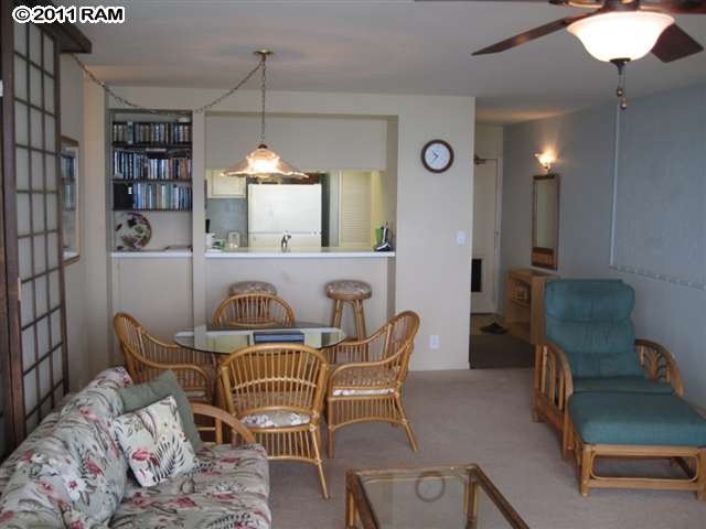 4401 Lower Honoapiilani Road, Unit A604 Lahaina, HI 96761 - Photo 4 of 29 a view of a dining room with furniture and chandelier