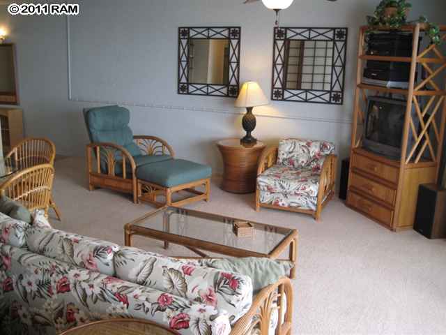 4401 Lower Honoapiilani Road, Unit A604 Lahaina, HI 96761 - Photo 5 of 29 a living room with furniture and a window