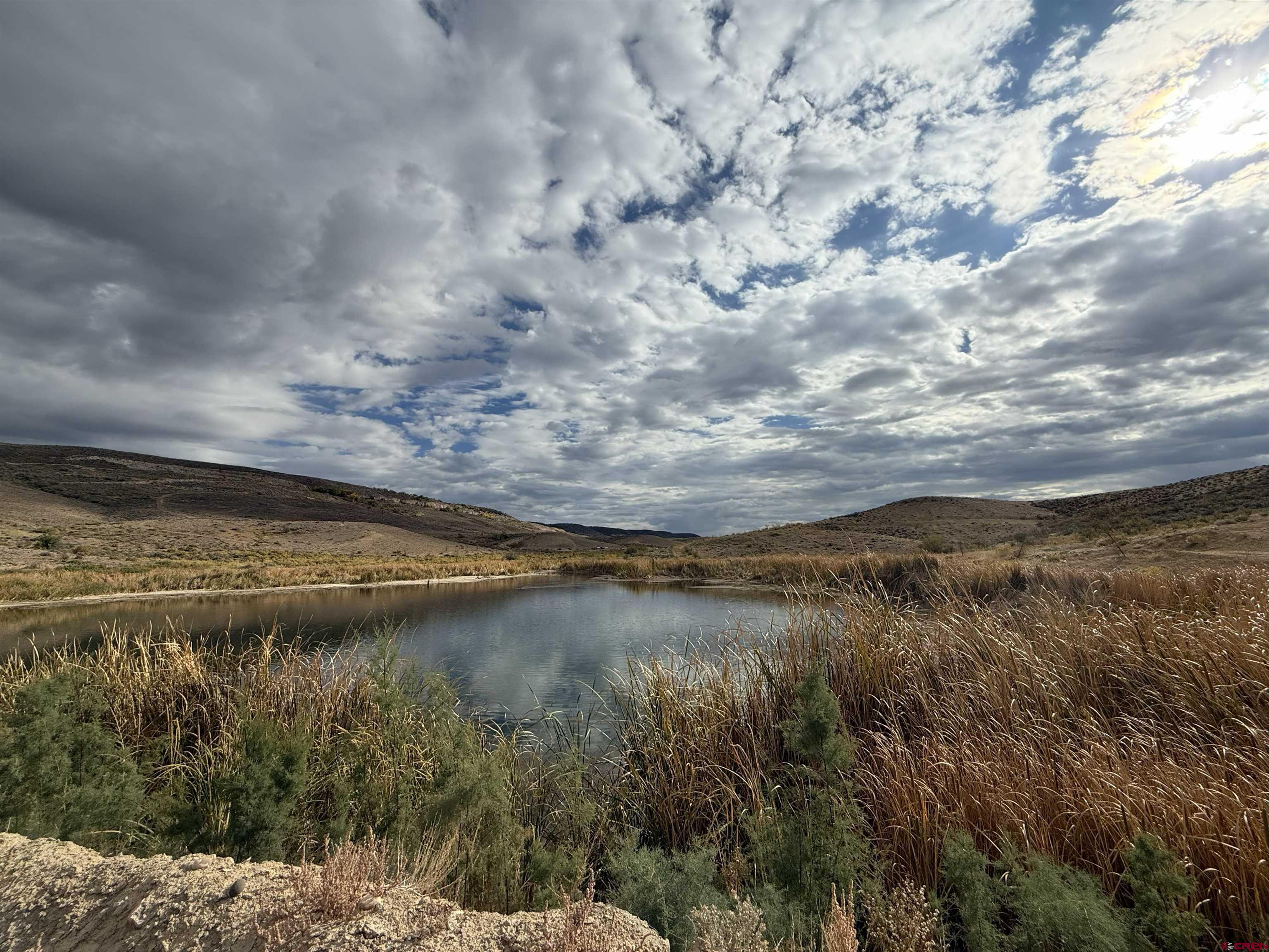 a view of a lake with a big yard