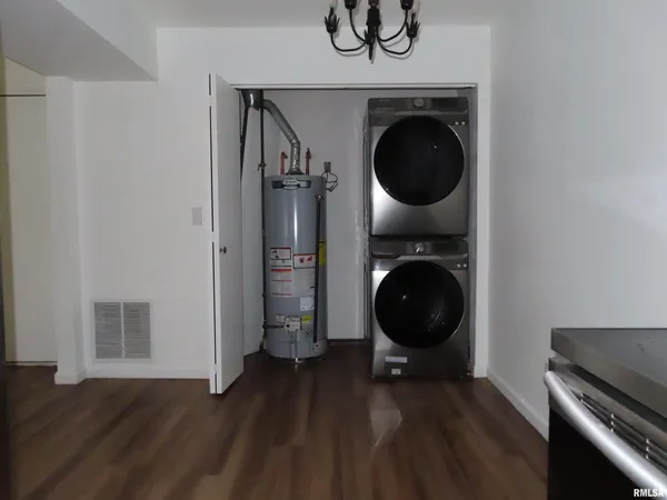 a view of a hallway with washer and dryer