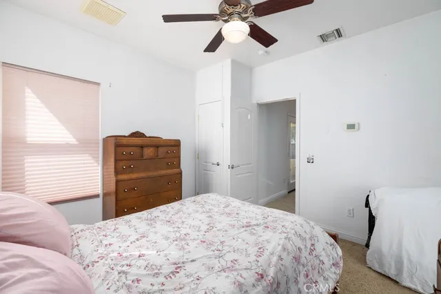 a bathroom with a sink vanity mirror and toilet