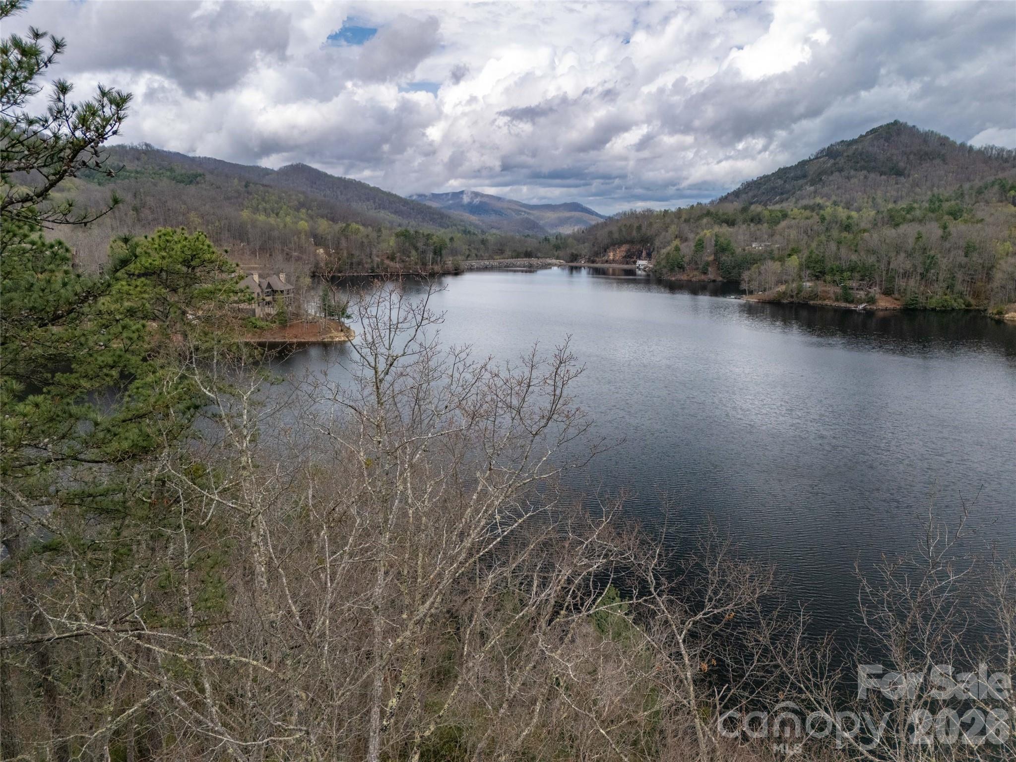159 Songcatcher Court, Unit 159 Tuckasegee, NC 28783 - Photo 19 of 44 a view of lake with mountain and trees