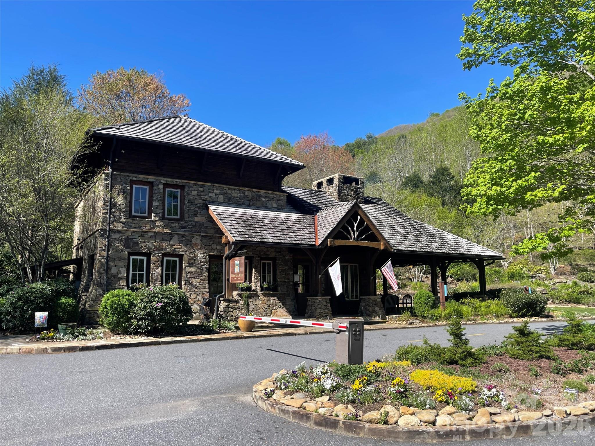 159 Songcatcher Court, Unit 159 Tuckasegee, NC 28783 - Photo 24 of 44 a front view of a house with garden