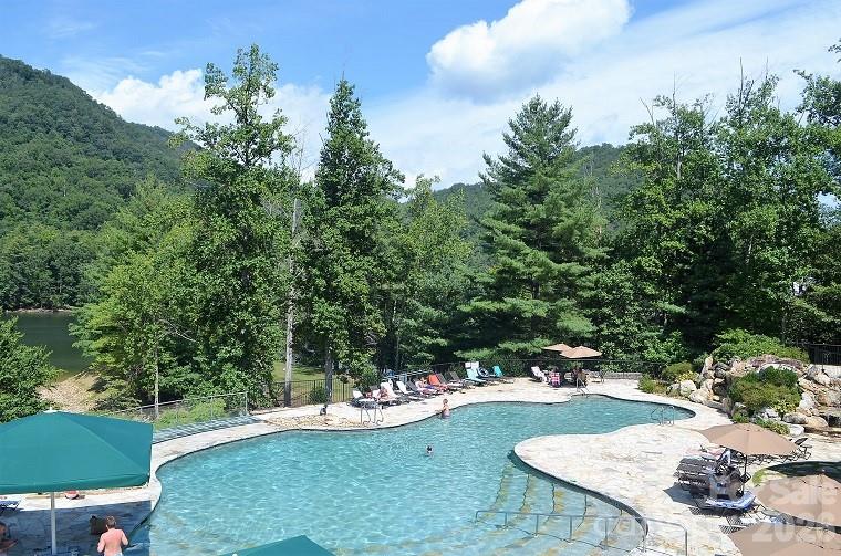 159 Songcatcher Court, Unit 159 Tuckasegee, NC 28783 - Photo 27 of 44 a view of a backyard with sitting area