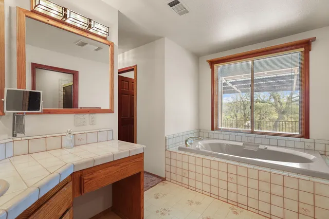 a bathroom with a bathtub and a sink