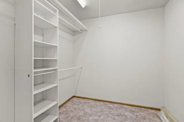 a view of an empty walk in closet