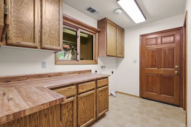 a kitchen that has a sink and a window