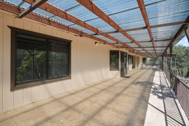 a view of a porch with a door and a glass door