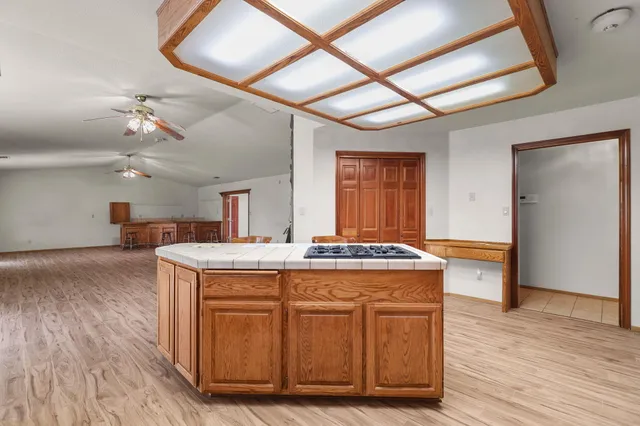 a view of a kitchen counter space and wooden floor